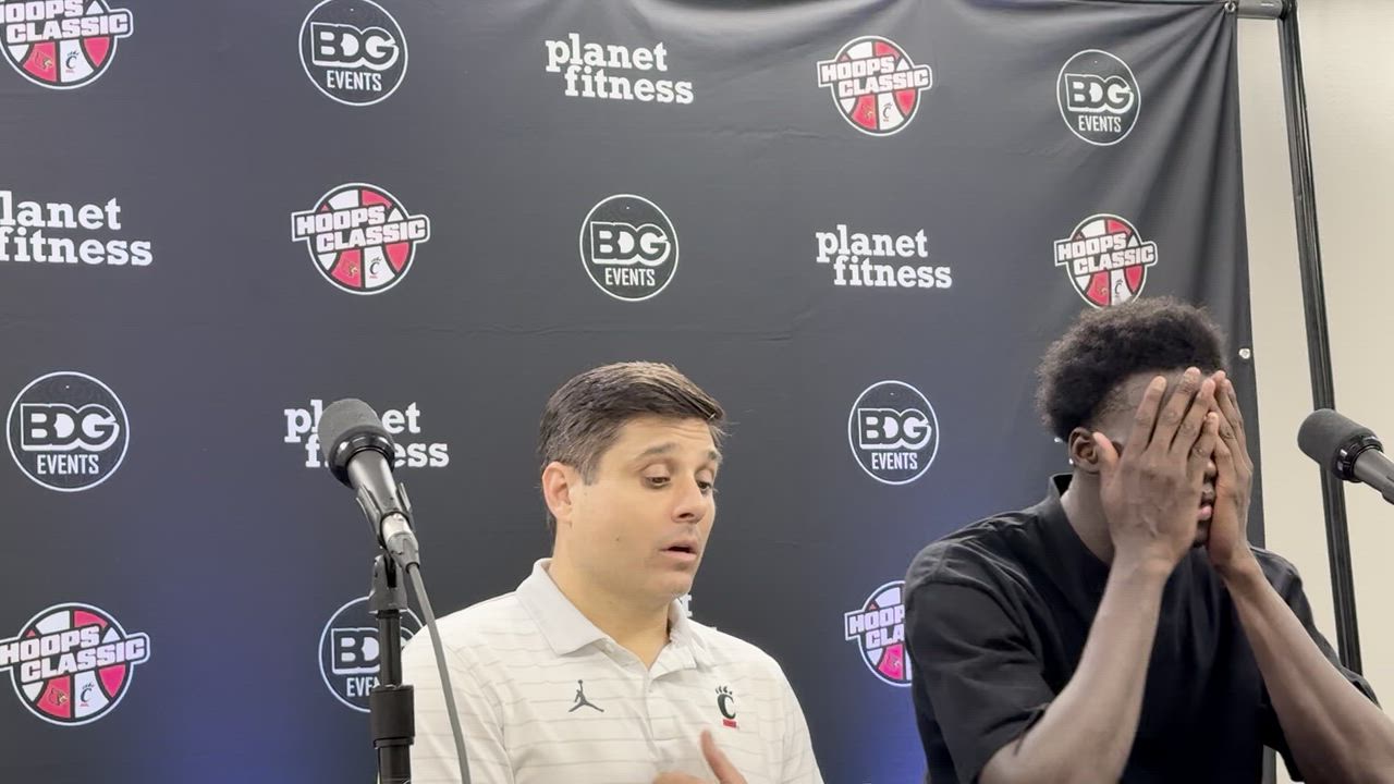 Wes Miller and Moustapha Thiam following the Bearcats 74-64 loss to Louisville